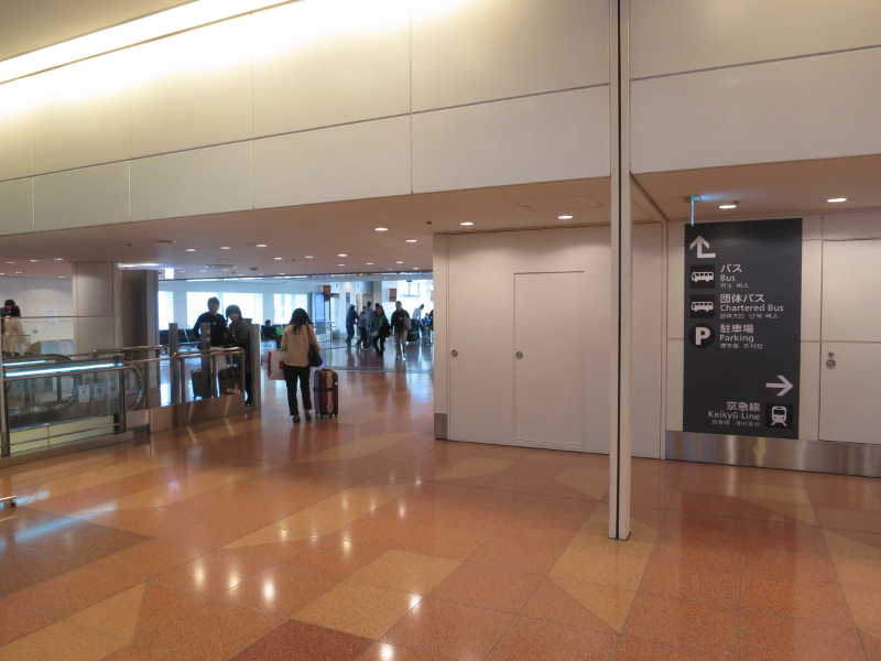 Bus stops are on the first floor after going down the passageway in front of the arrival lobby.